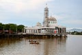 New under construction Islamic floating mosque with two domes at Sarawak river waterfront Kuching Malaysia