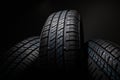 New and unused car tires against dark background Royalty Free Stock Photo