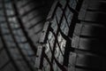 New and unused car tires against dark background Royalty Free Stock Photo