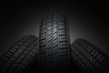 New and unused car tires against dark background Royalty Free Stock Photo