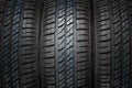 New and unused car tires against dark background Royalty Free Stock Photo