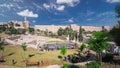New urban Teddy Park and Tower of David on background under blue sky timelapse hyperlapse in Jerusalem, Israel.