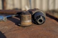 New and used arm bushing on rusty metal. Royalty Free Stock Photo