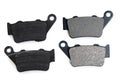 New and used brake pads for motorcycle on white Royalty Free Stock Photo