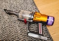 New Vacuum Cleaner with Dust and Pet Hair on Cleaned Floor