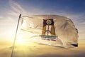 New Valley Governorate of Egypt flag textile cloth fabric waving on the top sunrise mist fog Royalty Free Stock Photo