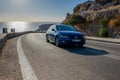 New Volkswagen Golf 8 on a winding road Royalty Free Stock Photo