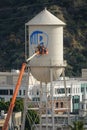 New Warner Bros. Blue Shield Logo Being Painted on Water Tower