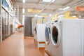 New washing machines in electronics store, nobody Royalty Free Stock Photo