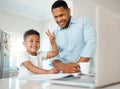 The new way of learning. Shot of a father and son doing homework together at home. Royalty Free Stock Photo