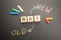 New Way and Old Way Concept. Text on a black chalkboard background Royalty Free Stock Photo