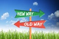 New way vs old way on wooden arrows with blue sky Royalty Free Stock Photo