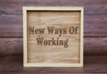 New Ways Of Working text engraved on wooden frame. New business culture concept