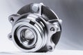 New Wheel hub assembly with bearing. This is part of the car suspension on a gray background with a gradient. The