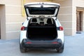 New white car open trunk. Modern car with open empty trunk. Modern wagon car open trunk. Car boot is open. Royalty Free Stock Photo