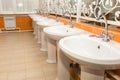 New white ceramic sinks and hand dryers Royalty Free Stock Photo