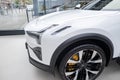 new white electric crossover Polestar 3 Swedish company Polestar in showroom, trends in use EV in contemporary Europe,