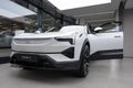 new white electric crossover Polestar 3 Swedish company Polestar in showroom, trends in use EV in contemporary Europe,