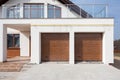 New white house with double garage doors and balcony. Royalty Free Stock Photo