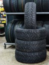 New winter tire set with studs at tire shop