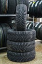 New winter tire set with studs at tire shop Royalty Free Stock Photo