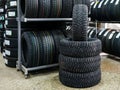 New winter tire set with studs at tire shop Royalty Free Stock Photo