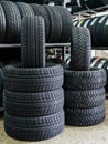 New winter tire sets with studs and without studs at tire shop Royalty Free Stock Photo