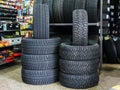 New winter tire sets with studs and without studs at tire shop Royalty Free Stock Photo