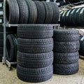 New winter tire sets with studs and without studs at tire shop Royalty Free Stock Photo