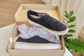 New womens black natural suede sneakers in box at home