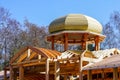 New wooden building frame with a round domed tower