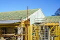 New wooden construction building in the construction process, roofing with waterproofing film