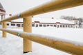 New wooden fence corral for outdoor horses. Fence of round wooden logs