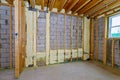 Basement unfinished under construction the wall of a new wooden house in foam for insulation Royalty Free Stock Photo