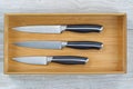 New Wooden Kitchen Drawer with Clean Knife Set on white wood