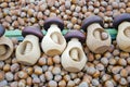 Wooden nutcrackers and hazelnuts in market Royalty Free Stock Photo