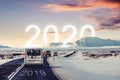 New year and new achievements concept. Group of car driving on the road heading to 2020 with 2019 on the road