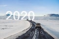 New year and new achievements concept. Group of car driving on the road heading to 2020 with 2019 on the road