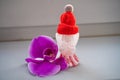 Christmas fun decorative, new year angel in red cap with flower. Christmas theme Royalty Free Stock Photo