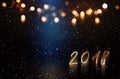 New year background with blue light beam and golden bokeh Royalty Free Stock Photo