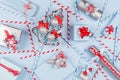 New Year background - bright blue, red and silver metallic gift boxes, straws and christmas tree with ribbons, snowflakes. Royalty Free Stock Photo