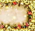 New Year. Background, frame of Christmas tree branches and Christmas decorations. Golden snow. Free space for text. Royalty Free Stock Photo