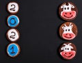 New Year 2021 background. Gingerbread cookies with numbers and cows