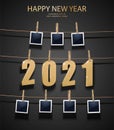 New Year background with golden 3d letters 2021 and photo frames hanging on the memory board. Celebration background