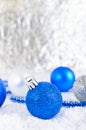 New Year banner with blue, silver and white Christmas balls in snow on abstract winter background Royalty Free Stock Photo