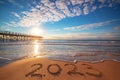 New Year 2023 beach sunrise. Text 2023 in sea sand, nature ocean landscape Royalty Free Stock Photo