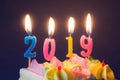 New Year 2019. Burning festive candles on cake close-up Royalty Free Stock Photo