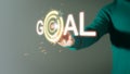 New year business ideas, man touching the virtual screen goal icon with target and goals in new year 2023, business strategy,