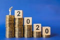 2020 New year, Business, Money and Planning Concept. Close up of businessman miniature figure people standing on top of stack of Royalty Free Stock Photo