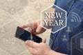 New Year, button on the touch screen with a blur background of t Royalty Free Stock Photo